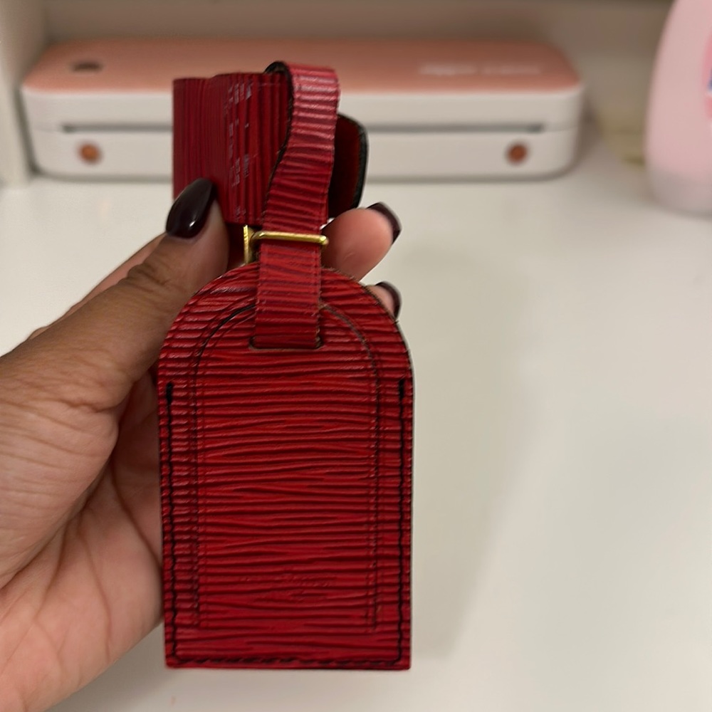 Vintage used Louis Vuitton travel luggage tag in the epi red leather